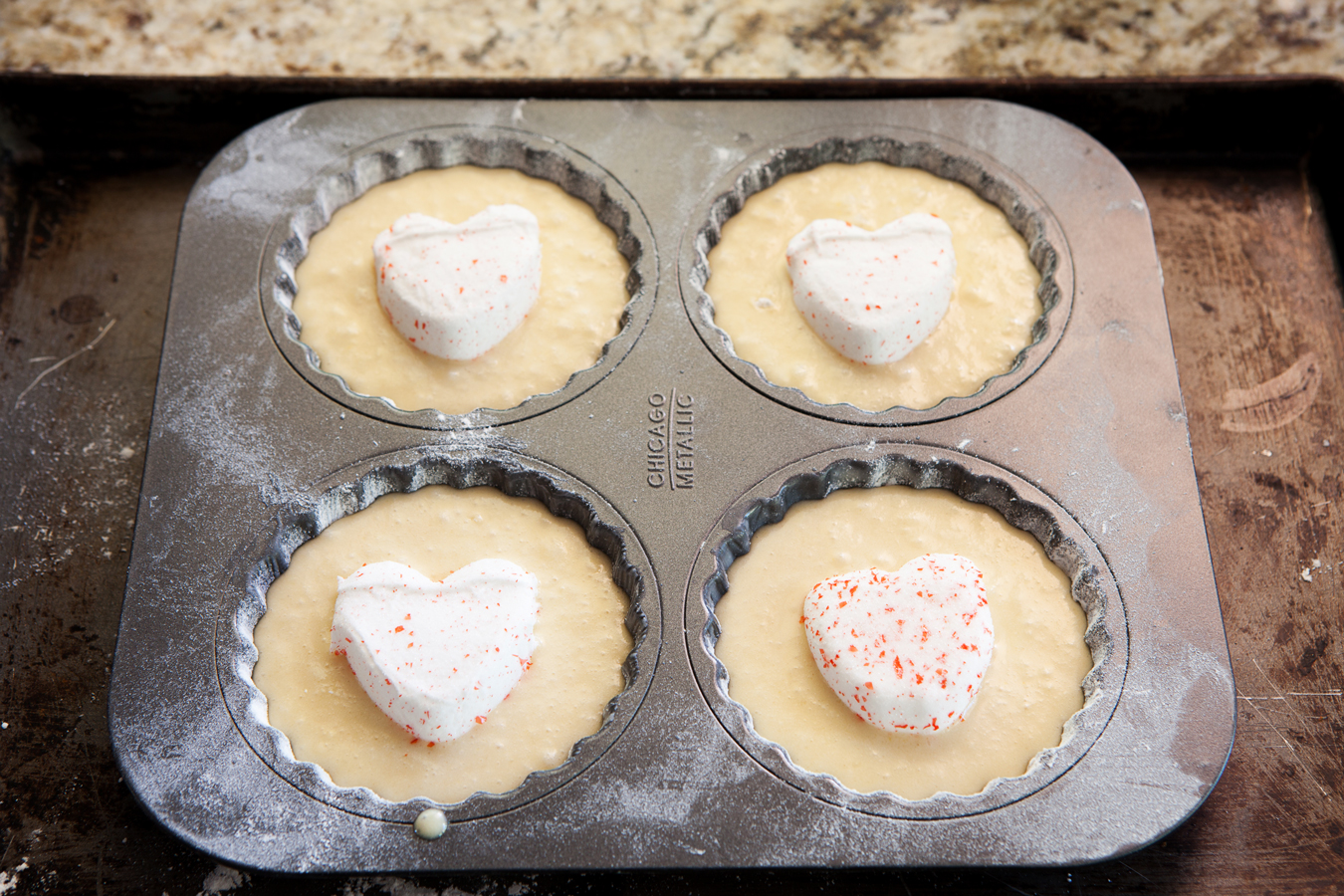 Vanilla Creme Cakelettes ~ Soft and moist individual cakes topped with a PEEPS® heart. No frosting needed!