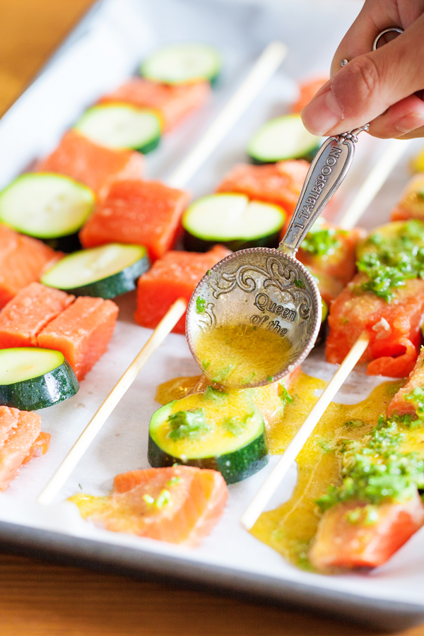 Gluten-free Mediterranean Rice & Quinoa Bowl with Salmon Kebabs has fresh herbs and vegetables that will keep you coming back for more!