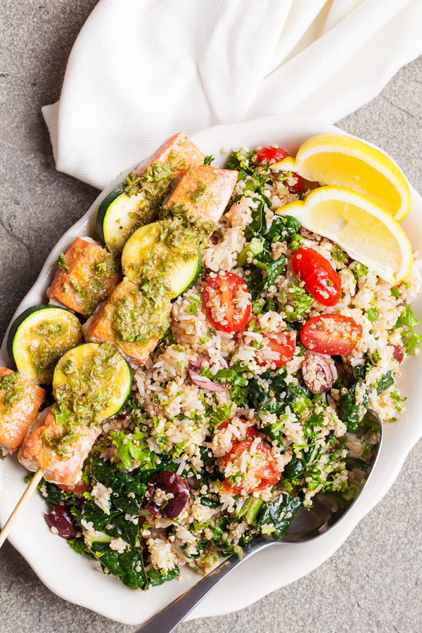 Gluten-free Mediterranean Rice & Quinoa Bowl with Salmon Kebabs has fresh herbs and vegetables that will keep you coming back for more!