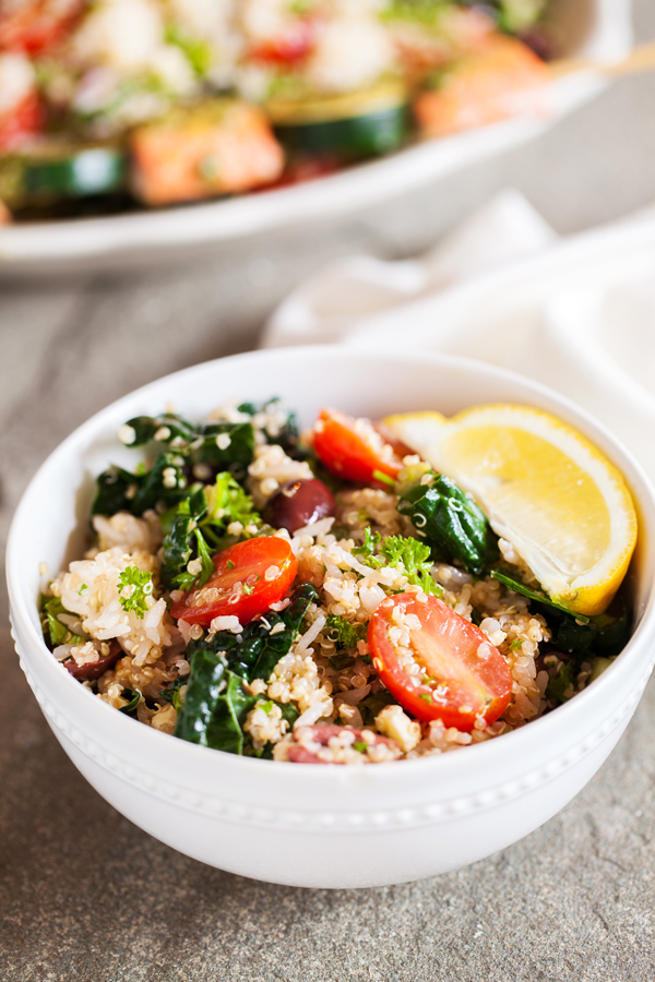 Gluten-free Mediterranean Rice & Quinoa Bowl with Salmon Kebabs has fresh herbs and vegetables that will keep you coming back for more!