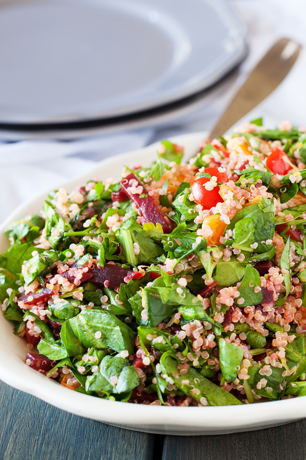 A bed of quinoa and spinach topped with a confetti of beets, mandarins, and tomatoes, this quinoa confetti salad is full of nutrients, vitamins, and fiber to make your meal that much healthier.