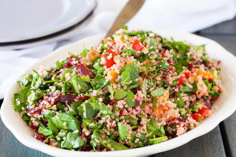 A bed of quinoa and spinach topped with a confetti of beets, mandarins, and tomatoes, this quinoa confetti salad is full of nutrients, vitamins, and fiber to make your meal that much healthier.