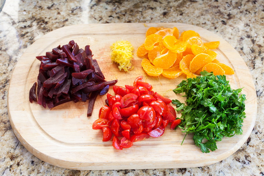 A bed of quinoa and spinach topped with a confetti of beets, mandarins, and tomatoes, this quinoa confetti salad is full of nutrients, vitamins, and fiber to make your meal that much healthier.