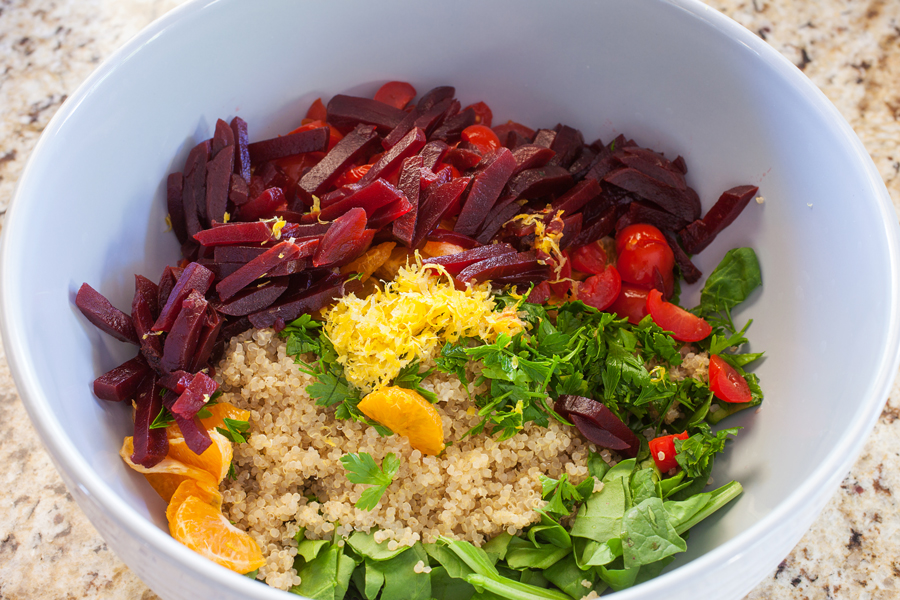 A bed of quinoa and spinach topped with a confetti of beets, mandarins, and tomatoes, this quinoa confetti salad is full of nutrients, vitamins, and fiber to make your meal that much healthier.