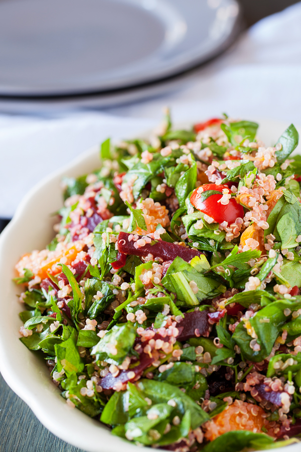 A bed of quinoa and spinach topped with a confetti of beets, mandarins, and tomatoes, this quinoa confetti salad is full of nutrients, vitamins, and fiber to make your meal that much healthier.