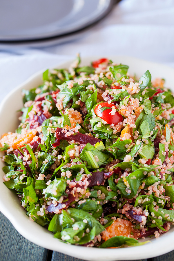 A bed of quinoa and spinach topped with a confetti of beets, mandarins, and tomatoes, this quinoa confetti salad is full of nutrients, vitamins, and fiber to make your meal that much healthier.