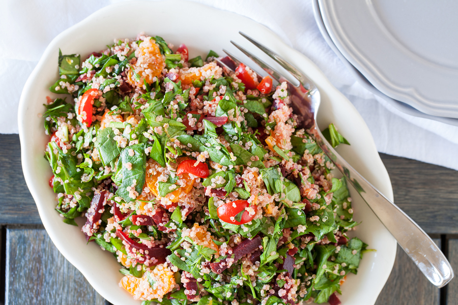 A bed of quinoa and spinach topped with a confetti of beets, mandarins, and tomatoes, this quinoa confetti salad is full of nutrients, vitamins, and fiber to make your meal that much healthier.