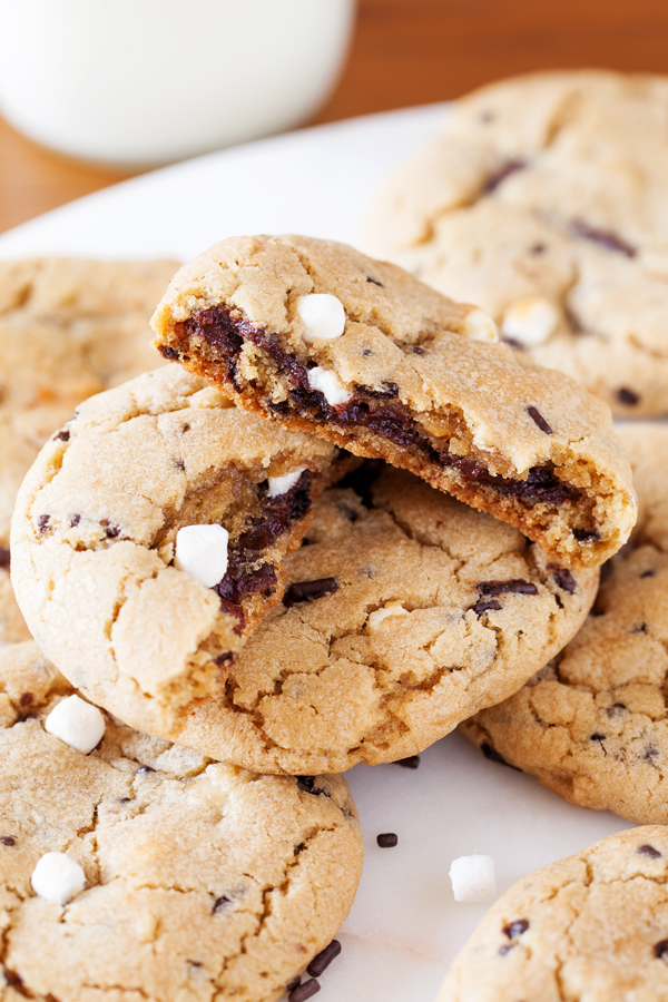 Rocky road reincarnated in cookie form. Full of marshmallows and walnuts, these rocky road cookies are soft, chewy, and gushing with rich ganache.