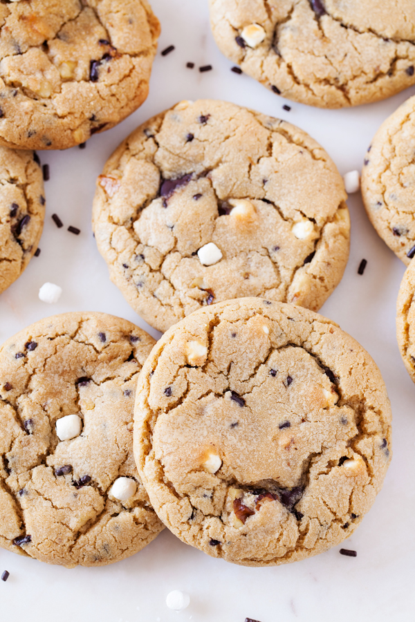 Rocky road reincarnated in cookie form. Full of marshmallows and walnuts, these rocky road cookies are soft, chewy, and gushing with rich ganache.