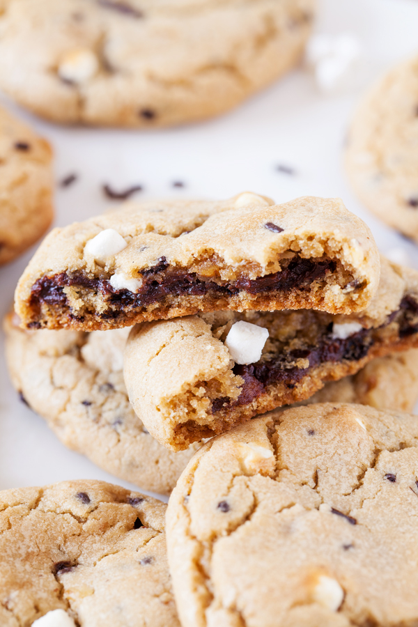 Rocky road reincarnated in cookie form. Full of marshmallows and walnuts, these rocky road cookies are soft, chewy, and gushing with rich ganache.