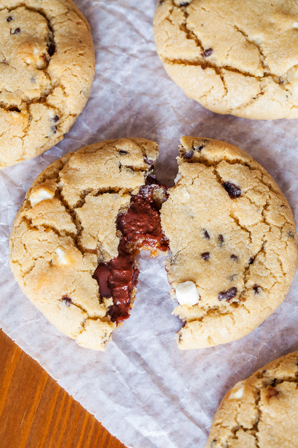 Rocky road reincarnated in cookie form. Full of marshmallows and walnuts, these cookies are soft, chewy, and gushing with rich ganache.