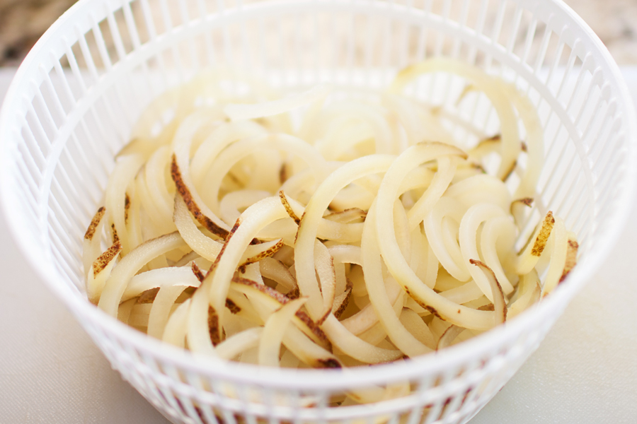 Crispy spiralized potato tossed in a taco seasoned sauce makes for a no-dressing-needed salad.