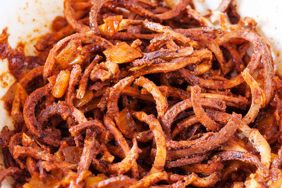 Crispy spiralized potato tossed in a taco seasoned sauce makes for a no-dressing-needed salad.