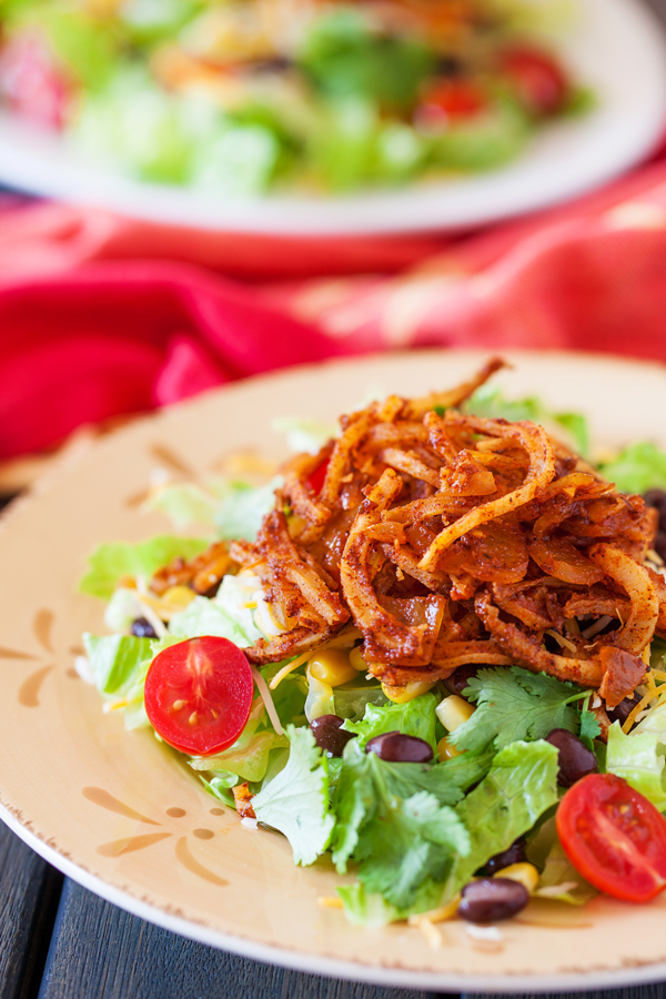 Crispy spiralized potato tossed in a taco seasoned sauce makes for a no-dressing-needed salad.