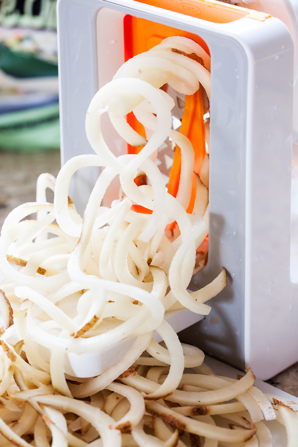 Crispy spiralized potato tossed in a taco seasoned sauce makes for a no-dressing-needed salad.