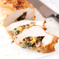 This succulent pork loin filet is filled with a sweet and savory stuffing and can be prepared in no time for an easy and delicious weeknight dinner.