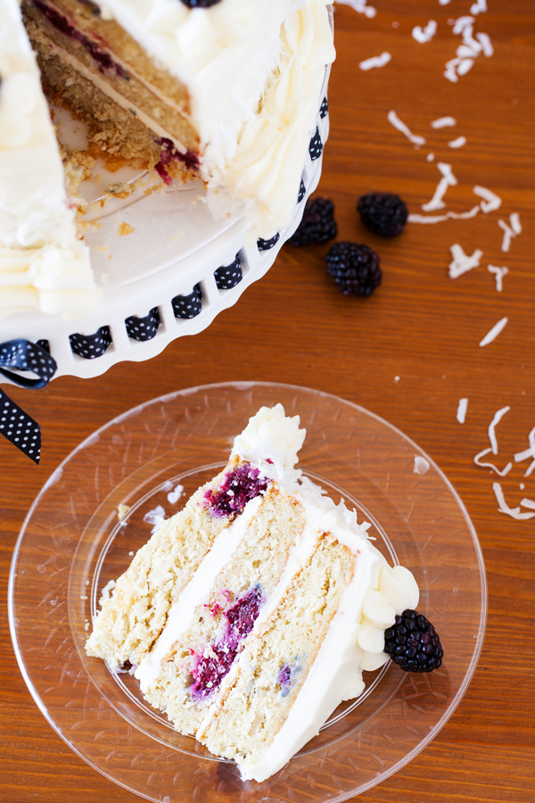 A cake for all occasions, this Blackberry Coconut Cake has a dense and moist crumb of blackberries and coconut, is filled with rich coconut buttercream, and frosted with tangy cream cheese frosting. Perfect for berry and coconut lovers everywhere. 