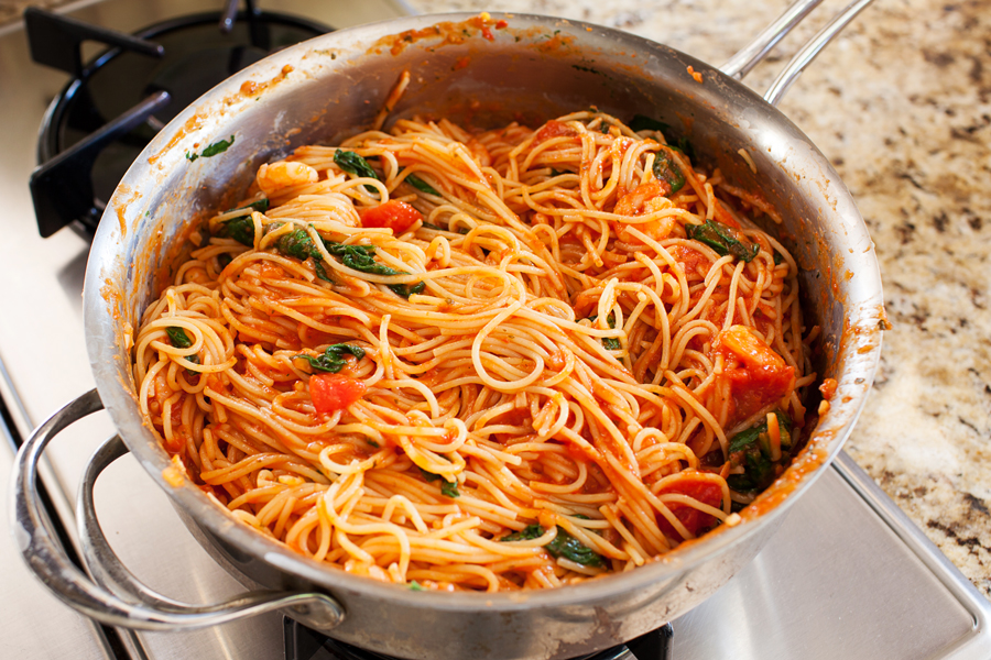 Talk about dinner on demand. This easy spicy shrimp pasta cooks in one pan, has only 5 ingredients, and cooks in 10 minutes!