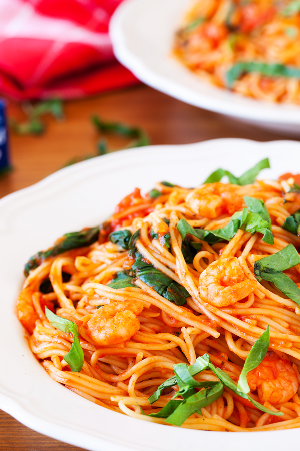 Talk about dinner on demand. This easy spicy shrimp pasta cooks in one pan, has only 5 ingredients, and cooks in 10 minutes!