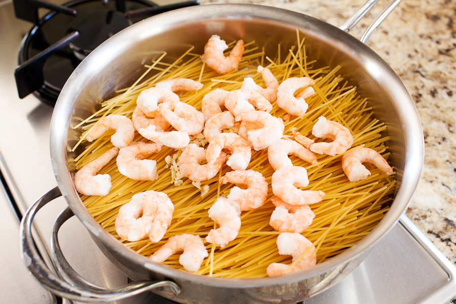 Talk about dinner on demand. This easy spicy shrimp pasta cooks in one pan, has only 5 ingredients, and cooks in 10 minutes!