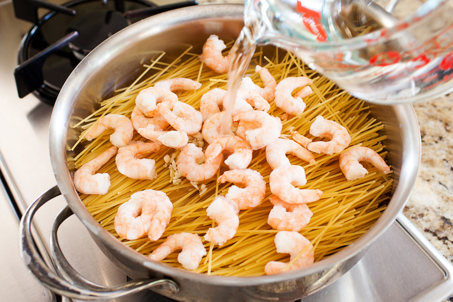 Talk about dinner on demand. This easy spicy shrimp pasta cooks in one pan, has only 5 ingredients, and cooks in 10 minutes!