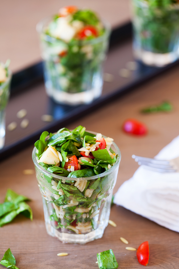 Classic caprese ingredients (basil, mozzarella, tomatoes, and balsamic vinaigrette) modernized into a salad with spinach and orzo pasta.