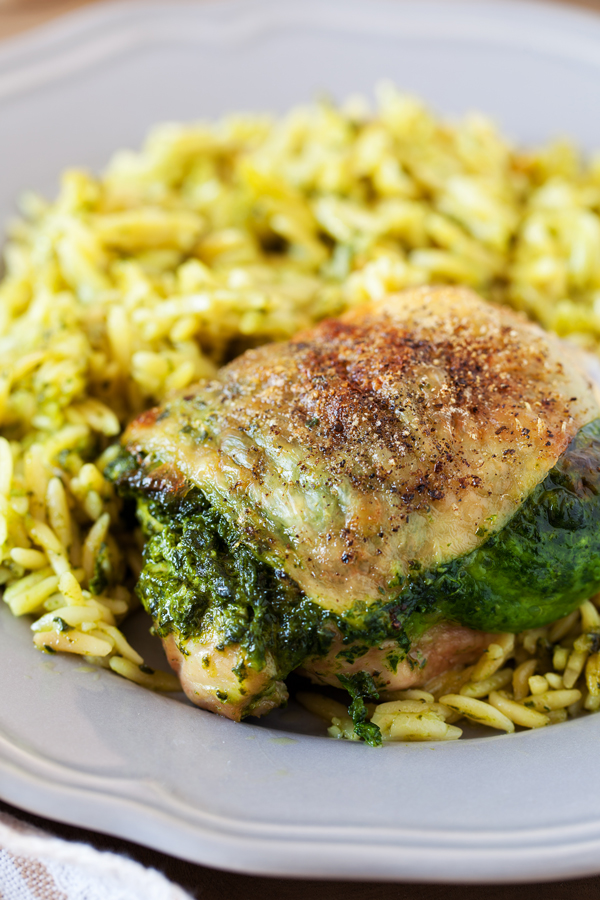 Entrée and side are ready at the same time with this Creamy Spinach Stuffed Chicken with Orzo. Chicken thighs are stuffed with a mixture of spinach and cheese then cooked together with orzo for an easy one-pan dinner.