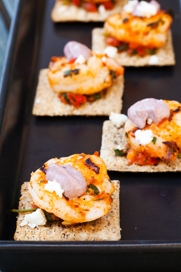 Grilled Mediterranean shrimp atop a crispy TRISCUIT cracker, sprinkled with tangy feta and dolloped with Kalamata olive aioli make these Mediterranean Shrimp Bites the perfect off-the-grill summer appetizer. 