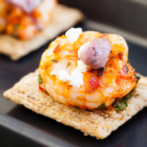 Grilled Mediterranean shrimp atop a crispy TRISCUIT cracker, sprinkled with tangy feta and dolloped with Kalamata olive aioli make these Mediterranean Shrimp Bites the perfect off-the-grill summer appetizer.