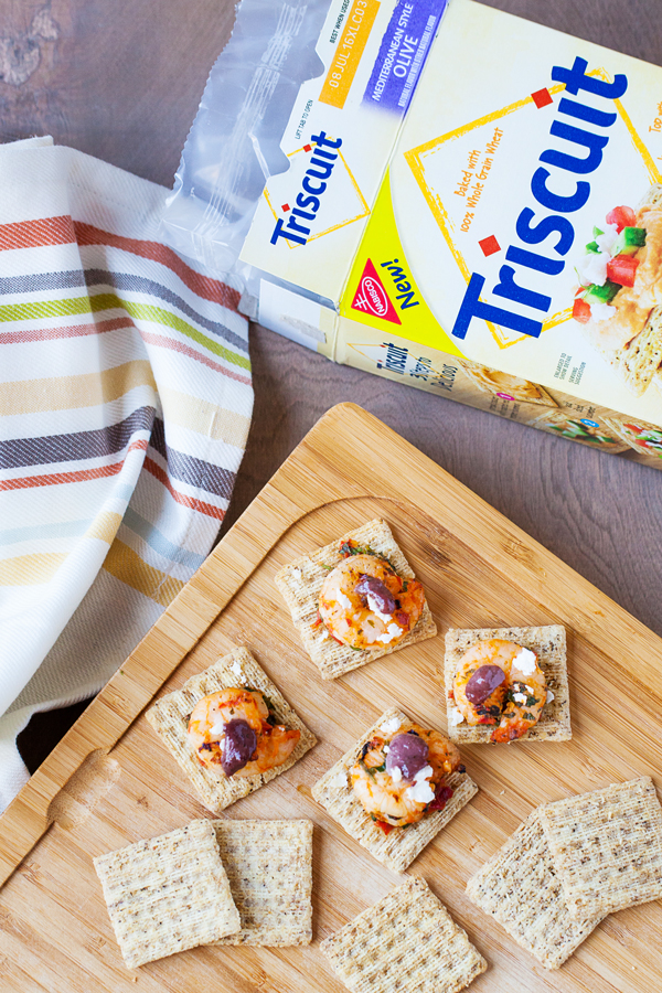 Grilled Mediterranean shrimp atop a crispy TRISCUIT cracker, sprinkled with tangy feta and dolloped with Kalamata olive aioli make these Mediterranean Shrimp Bites the perfect off-the-grill summer appetizer. 