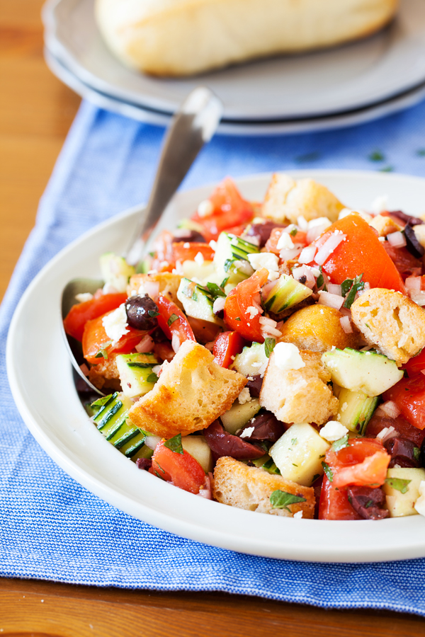 For a hefty side or a light main dish, this Panzanella is fresh and flavorful to accommodate even the pickiest eaters. Made from pre-toasted baguette cubes to prevent water-log, the cubes become softened yet maintain some chew in the fresh tomato juice-based vinaigrette.