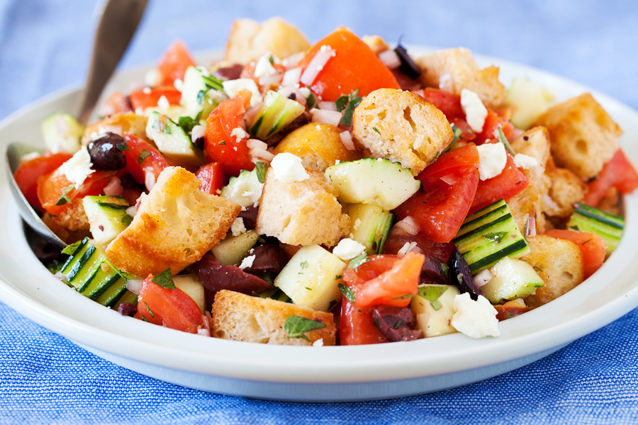 For a hefty side or a light main dish, this Panzanella is fresh and flavorful to accommodate even the pickiest eaters. Made from pre-toasted baguette cubes to prevent water-log, the cubes become softened yet maintain some chew in the fresh tomato juice-based vinaigrette.