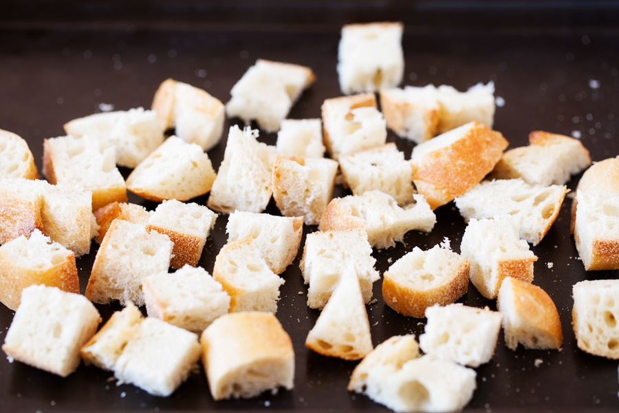 For a hefty side or a light main dish, this Panzanella is fresh and flavorful to accommodate even the pickiest eaters. Made from pre-toasted baguette cubes to prevent water-log, the cubes become softened yet maintain some chew in the fresh tomato juice-based vinaigrette.