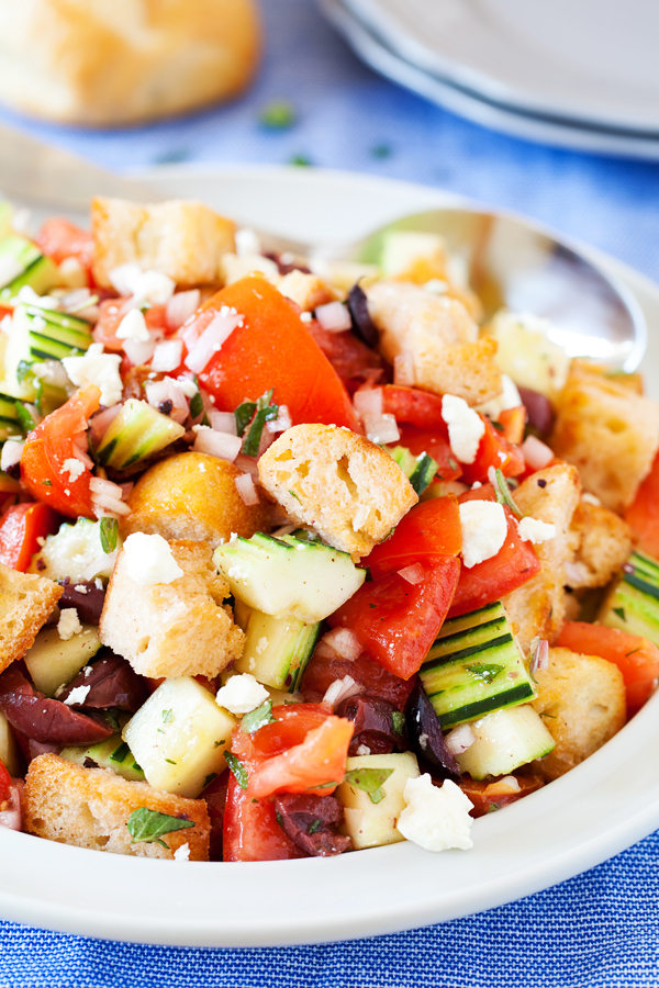 For a hefty side or a light main dish, this Panzanella is fresh and flavorful to accommodate even the pickiest eaters. Made from pre-toasted baguette cubes to prevent water-log, the cubes become softened yet maintain some chew in the fresh tomato juice-based vinaigrette.