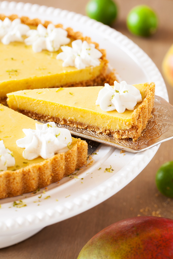 In this Mango Key Lime Tart, mango and key lime work together to create a sweet and sour, custard-like filling that sits atop a buttery graham cracker crust. The perfect dessert for summer BBQ’s, potlucks, and get-togethers.