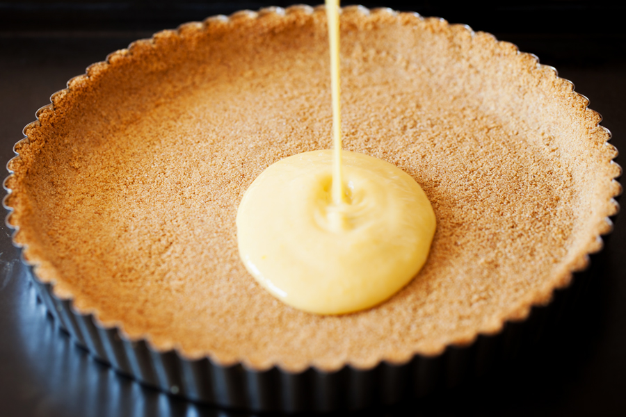 In this Mango Key Lime Tart, mango and key lime work together to create a sweet and sour, custard-like filling that sits atop a buttery graham cracker crust. The perfect dessert for summer BBQ’s, potlucks, and get-togethers.