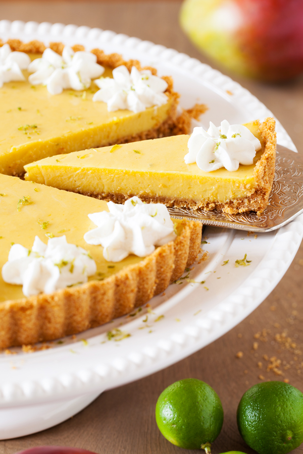 In this Mango Key Lime Tart, mango and key lime work together to create a sweet and sour, custard-like filling that sits atop a buttery graham cracker crust. The perfect dessert for summer BBQ’s, potlucks, and get-togethers.