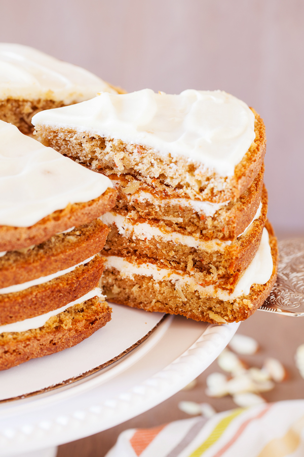 The addition of a secret ingredient makes this 4-Layer Moist Carrot Cake irresistible and addicting!