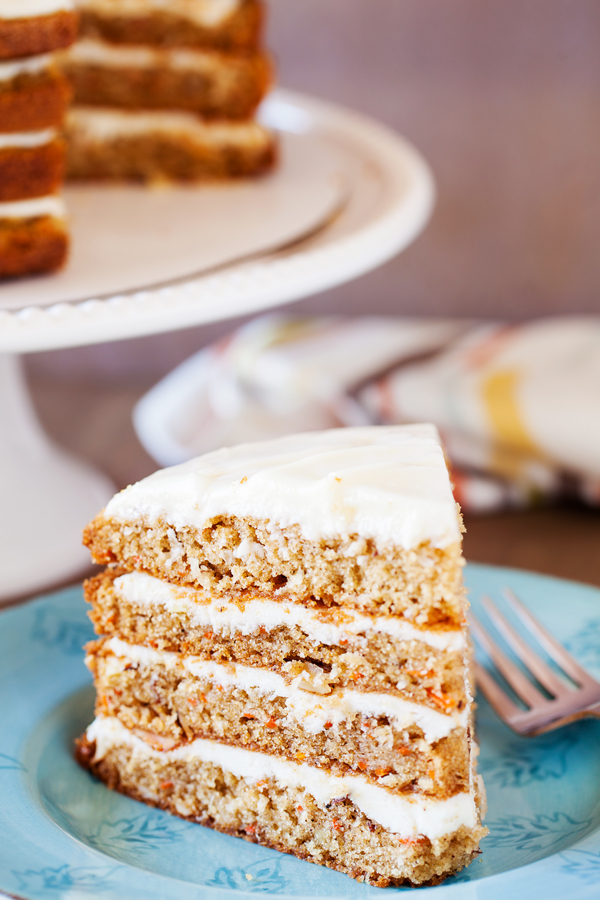 The addition of a secret ingredient makes this 4-Layer Moist Carrot Cake irresistible and addicting!