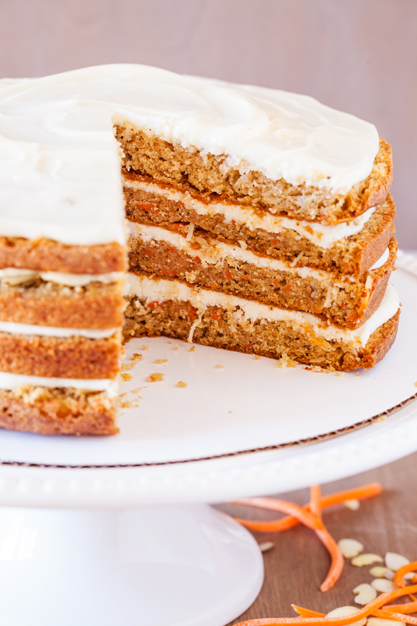 The addition of a secret ingredient makes this 4-Layer Moist Carrot Cake irresistible and addicting!