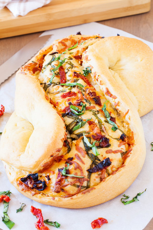 Great for bread baking beginners, this Pane Bianco (Italian for White Bread) is filled with sun-dried tomatoes, garlic, fresh basil, and mozzarella cheese, that will sure to impress.