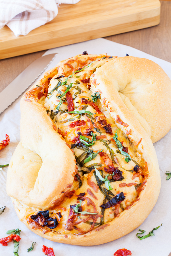 Great for bread baking beginners, this Pane Bianco (Italian for White Bread) is filled with sun-dried tomatoes, garlic, fresh basil, and mozzarella cheese, that will sure to impress.