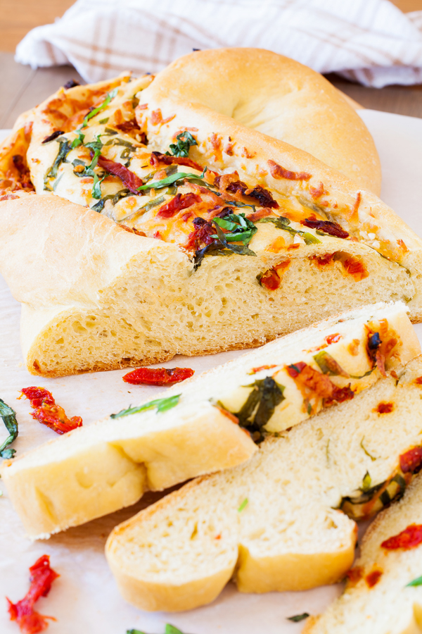 Great for bread baking beginners, this Pane Bianco (Italian for White Bread) is filled with sun-dried tomatoes, garlic, fresh basil, and mozzarella cheese, that will sure to impress.