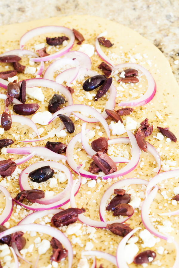 Olives, feta, and red onions add a slight twist and a Mediterranean flare to the traditional Pane Bianco.