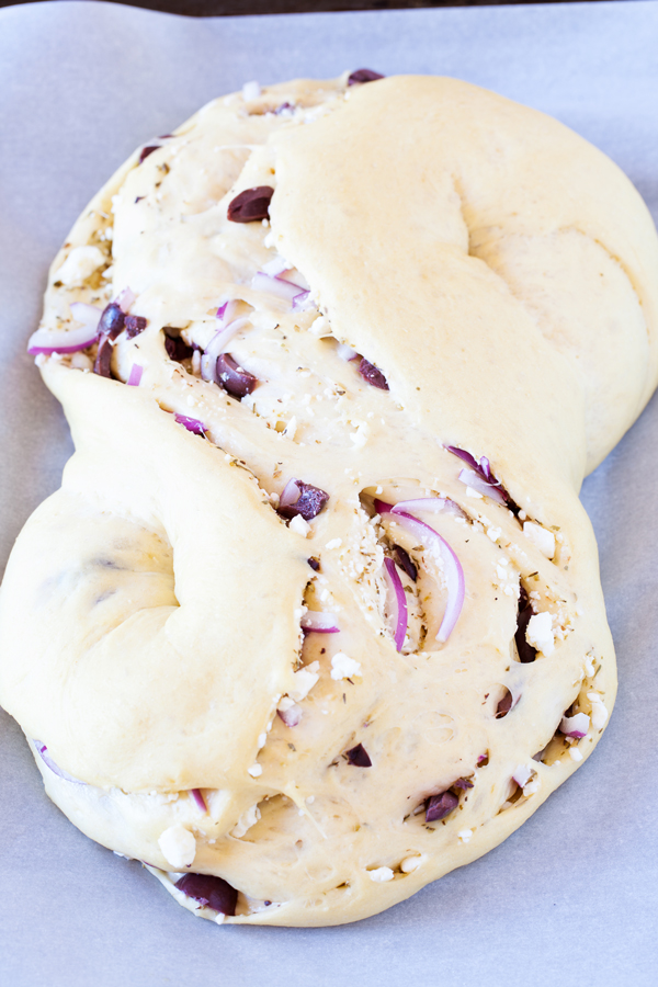 Olives, feta, and red onions add a slight twist and a Mediterranean flare to the traditional Pane Bianco.