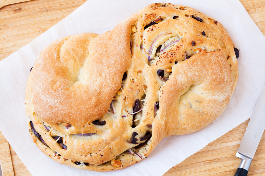 Olives, feta, and red onions add a slight twist and a Mediterranean flare to the traditional Pane Bianco.