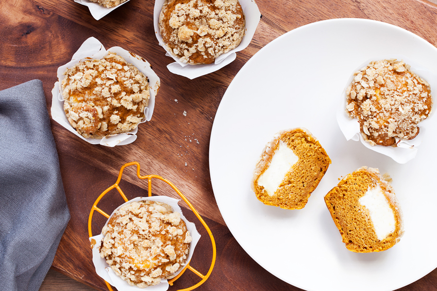 The perfect recipe to kick-off pumpkin season and fall, these Inside-Out Pumpkin Muffins feature a sweet and tangy cream cheese frosting stuffed inside a pumpkin spice muffin and topped with a crunchy streusel topping!