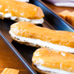 These Pumpkin Pie Spice Éclairs are made from a pumpkin pie spiced pate a choux, are filled with pumpkin pie spice whipped cream, and topped with a delicious caramel glaze that will sure to impress this holiday season.