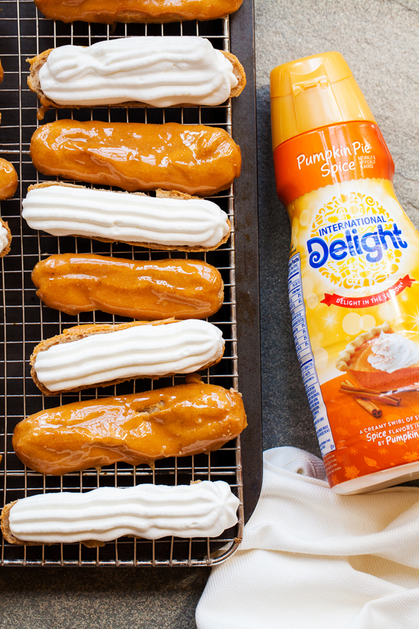These Pumpkin Pie Spice Éclairs are made from a pumpkin pie spiced pate a choux, are filled with pumpkin pie spice whipped cream, and topped with a delicious caramel glaze that will sure to impress this holiday season.