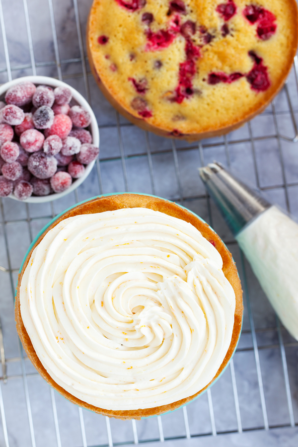 Infused with orange flavor and studded with juicy cranberries, this Orange Cranberry Cake is the perfect festive dessert for your Thanksgiving and holiday tables.